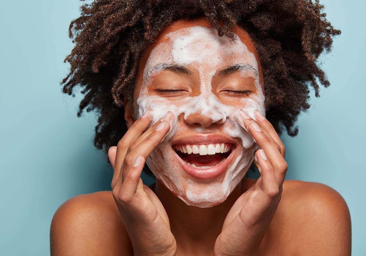 Woman adding two step cleansing to her skincare routine