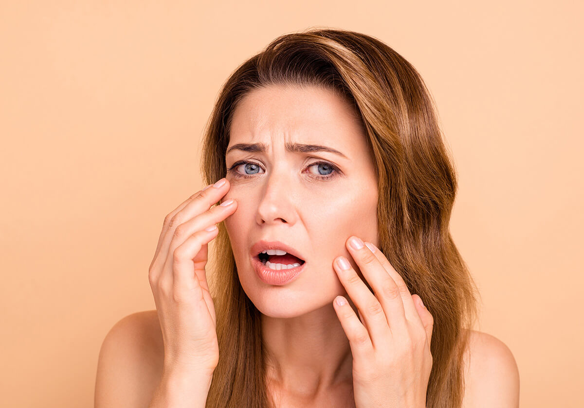 Women with buildup of dead skin on face