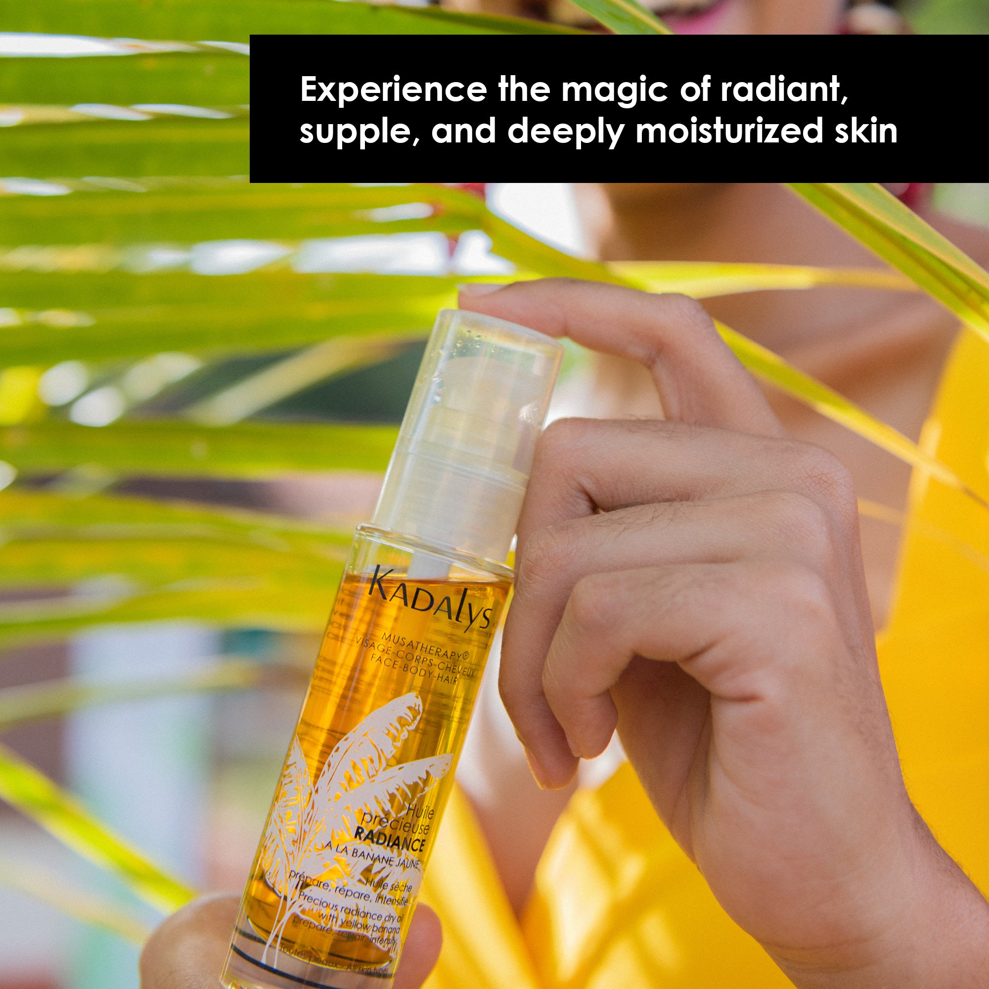 image of radiance oil being held by the hand of a Black woman with leaves in the background. Caption reads: experience the magic of radiant, supple and deeply moisturized skin.